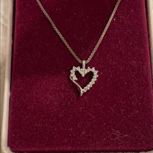 Heart shaped necklace with small diamonds.